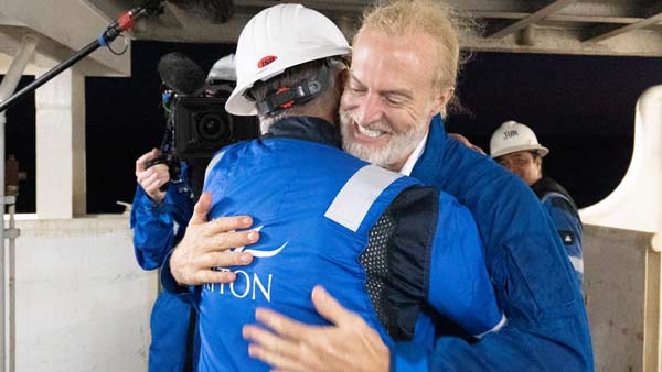 Triton customer Victor Vescovo embraces Triton Submarines’ Patrick Lahey following record-breaking dives.